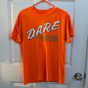 Bright orange Dare graphic tee